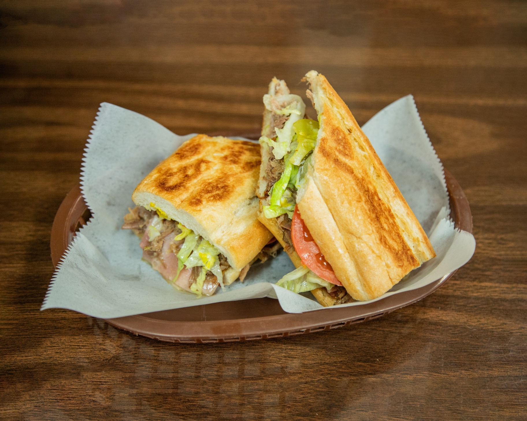 Cafe Caribe Cuban sandwich, pressed and served with lettuce and tomato